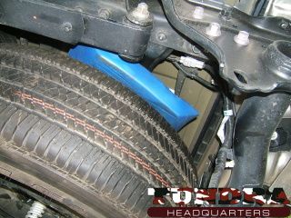 A view of the spare tire with foam from the left (or driver's) side.