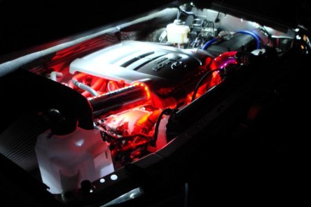 Red lava coolant and LED lighting give this engine compartment an eerie glow.