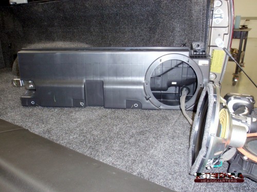 The stock subwoofer and enclosure in a 2010 Toyota Tundra