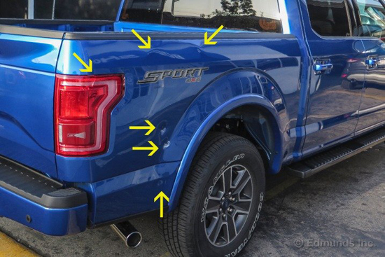 With a sledge hammer in hand, Edmunds damaged their new F-150 in order to answer the repair question.